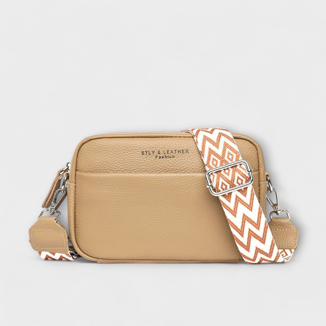Close-up of a women's textured mini crossbody bag, highlighting its fabric and versatile style.
