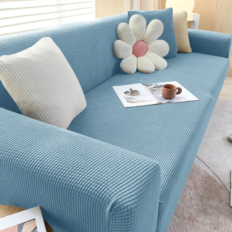Family enjoying a sofa with a durable, non-slip textured stretch cover, comfortable and stylish