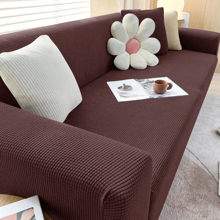Side view of modern sofa with a close-fitting textured stretch slipcover, aesthetic and functional