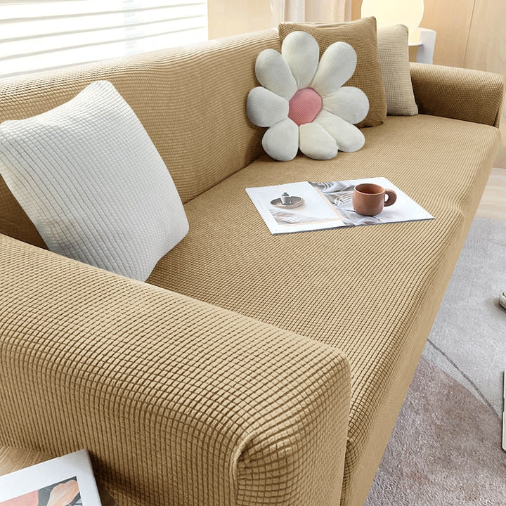 Collection of textured stretch sofa covers in various colors, showcasing home textile options