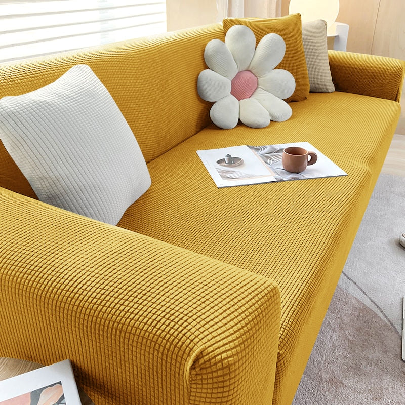 Living room accent: textured stretch sofa cover improving the look and feel of furniture