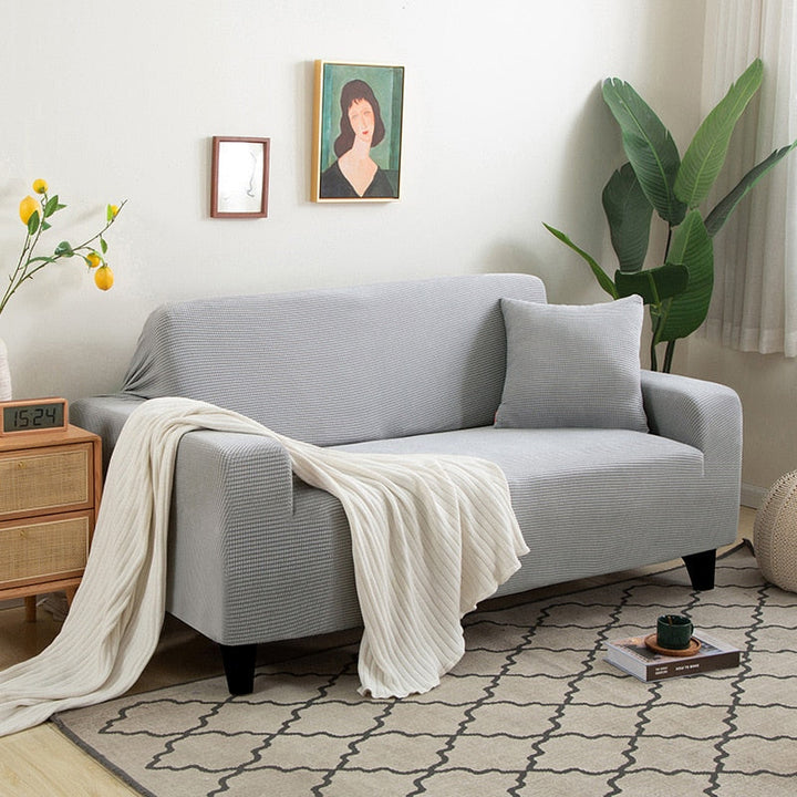 Textured stretch sofa cover's non-slip backing material, ensuring it stays firmly in place