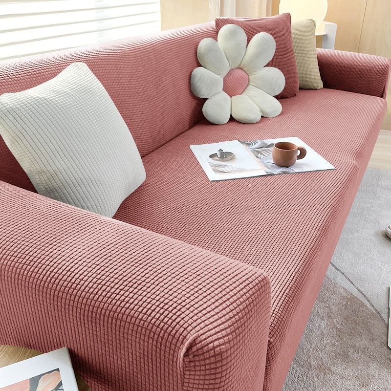 Detailed view of elastic band on textured stretch sofa cover ensuring a secure, non-slip fit