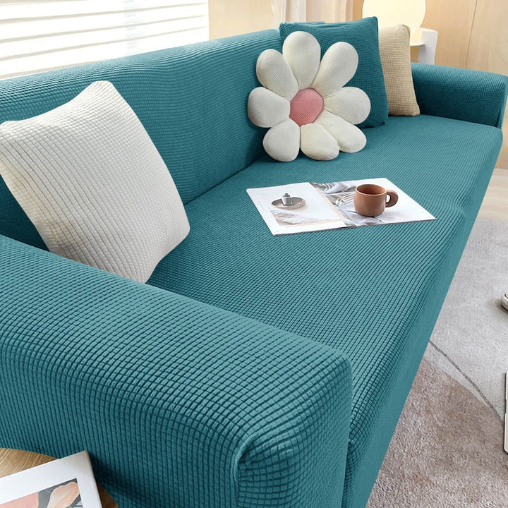 Textured sofa cover in a vibrant color, adding a pop of style to a living room setup