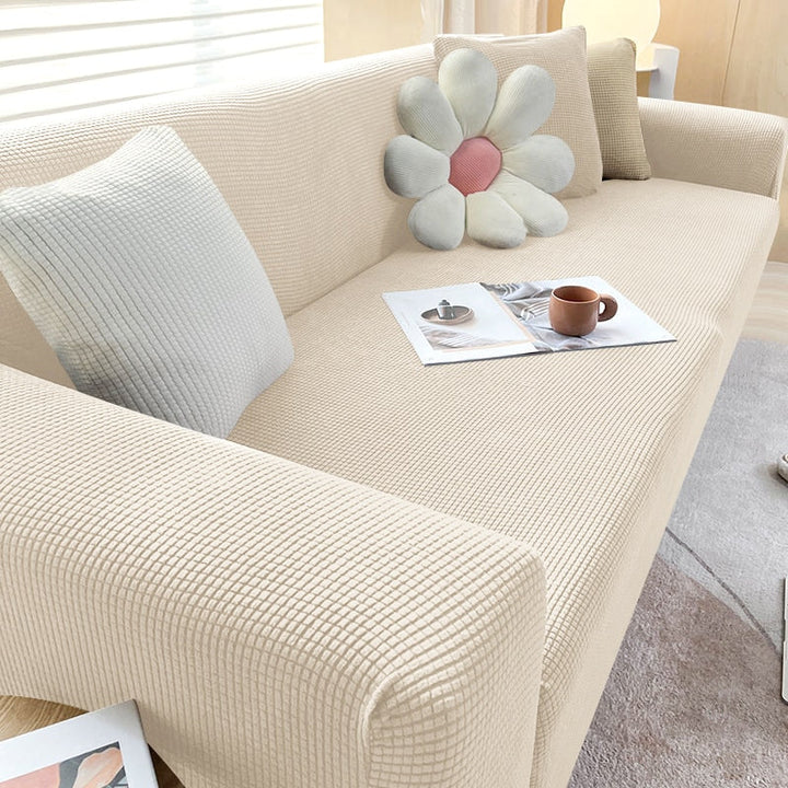 Furniture protector: textured stretch sofa cover guarding against daily wear and tear