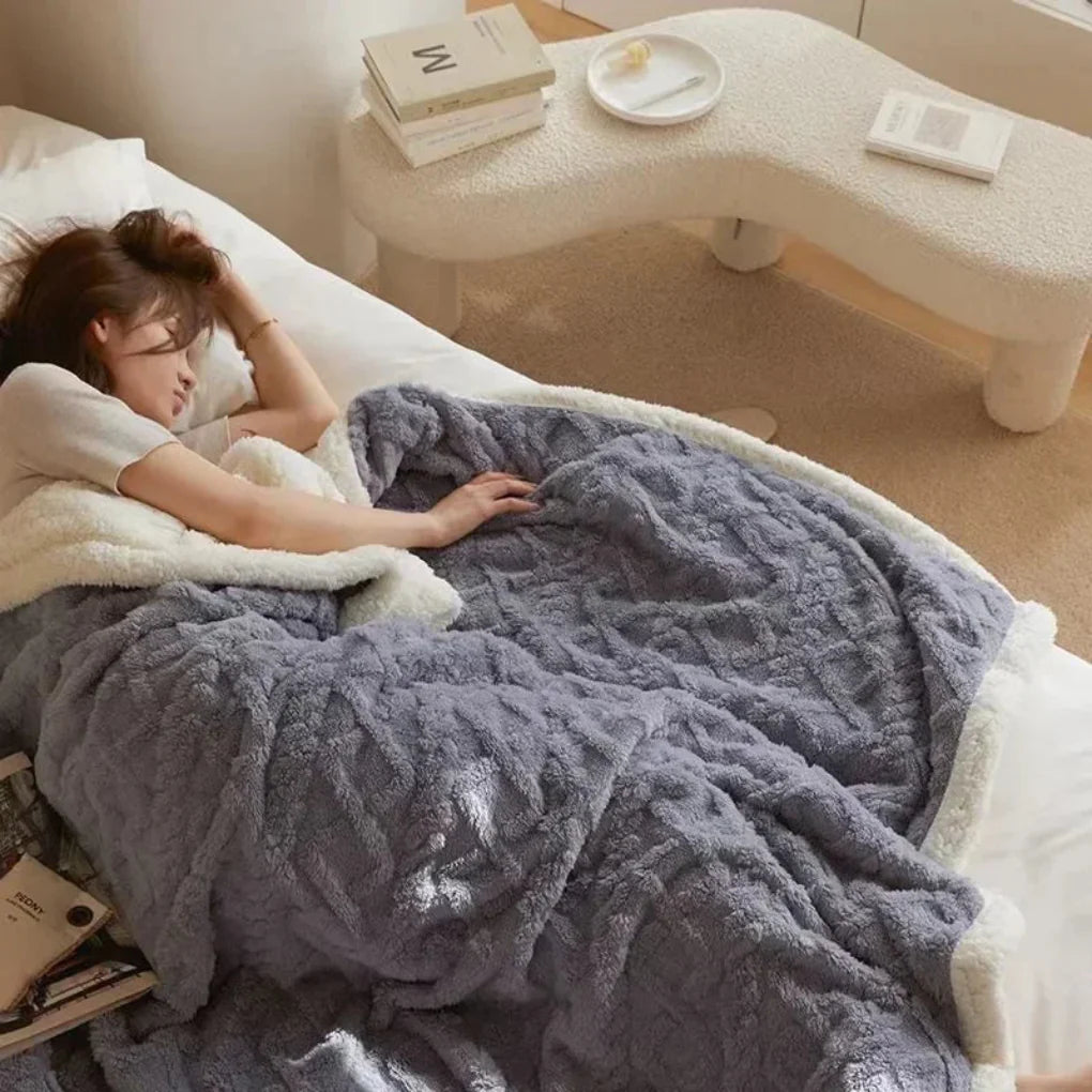 Cozy plush winter blanket covering a bed. Offers ultimate warmth and stylish bed cover for cold seasons.