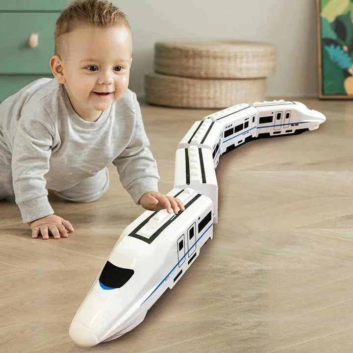 Kids' interactive train set with lights & sounds, promoting motor skills & educational play for toddlers. Bump & Go fun!