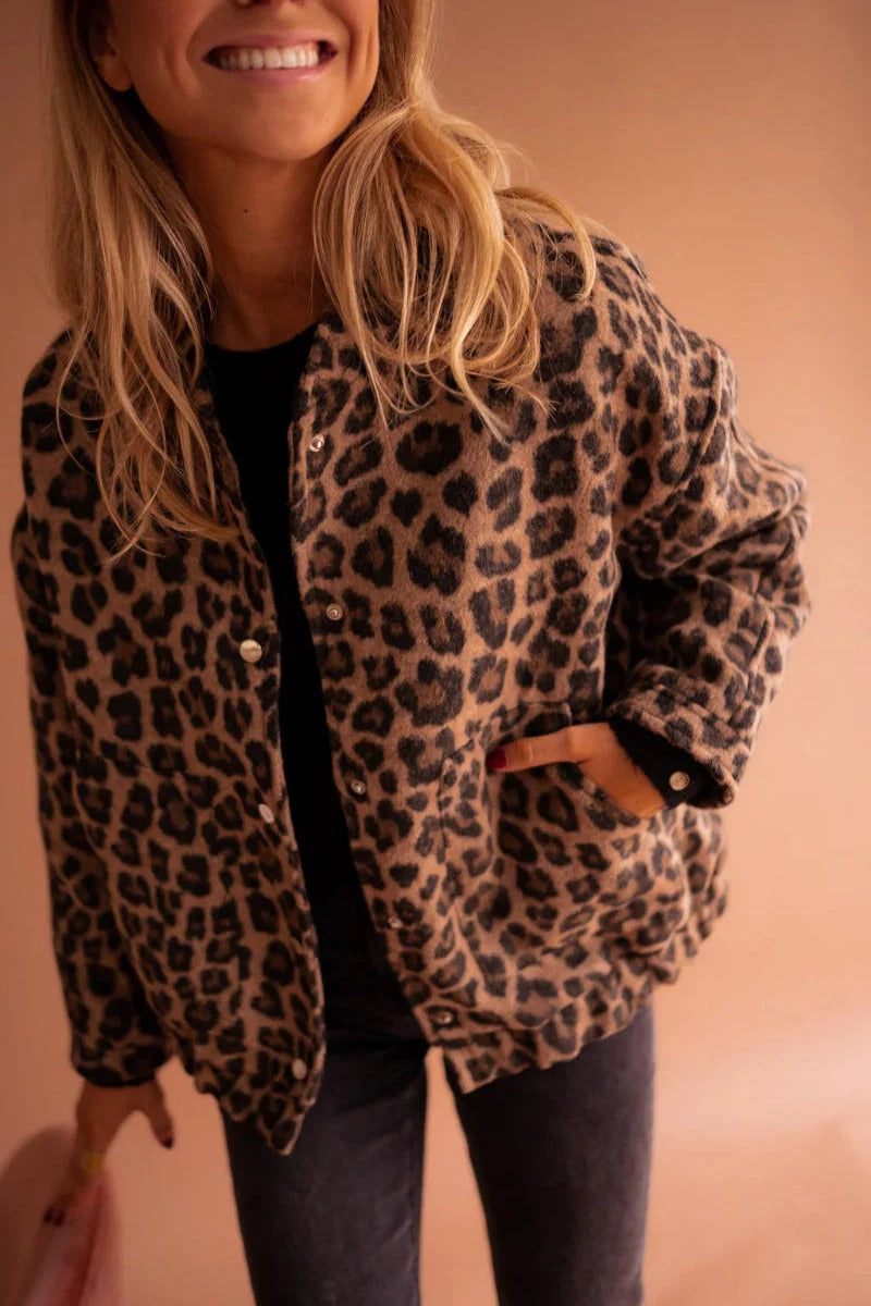 Trendy women's leopard print bomber jacket, a bold fashion statement piece for casual outerwear.
