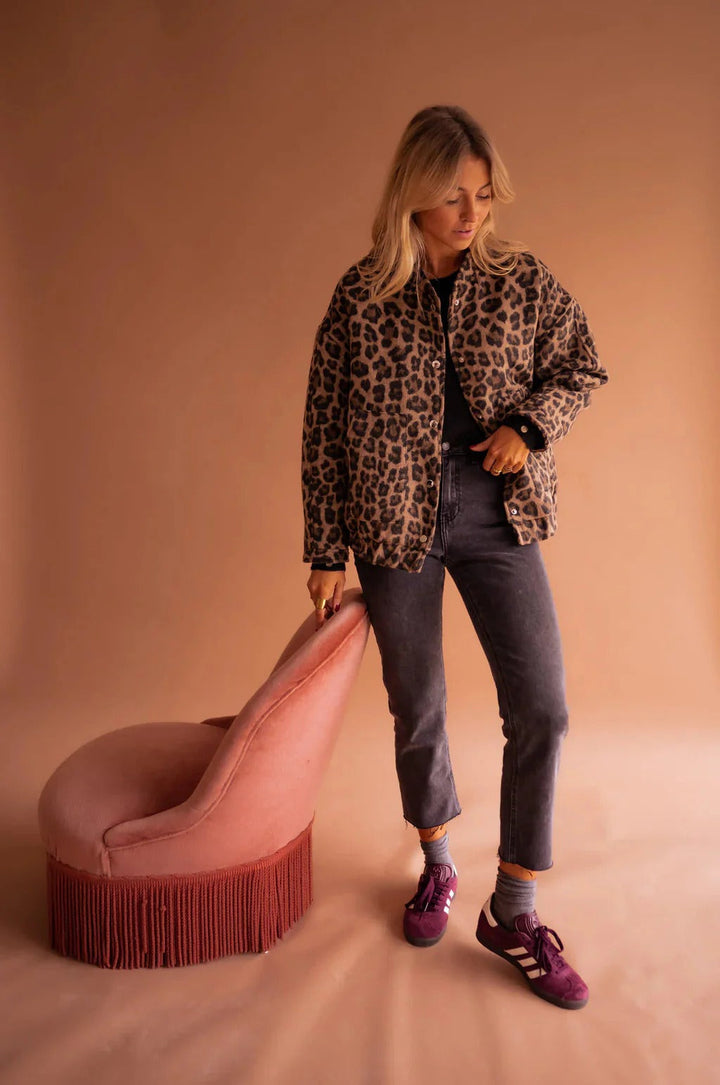 Bold leopard print bomber jacket for women, a stylish and trendy outerwear piece.