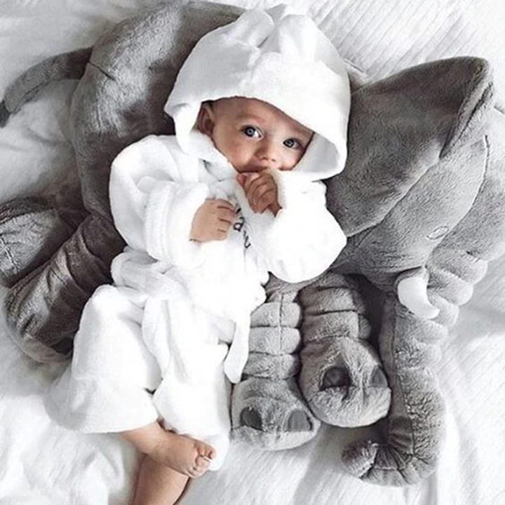 Baby room decor: soft elephant cuddle pillow, a plush toy providing ultimate huggable comfort.