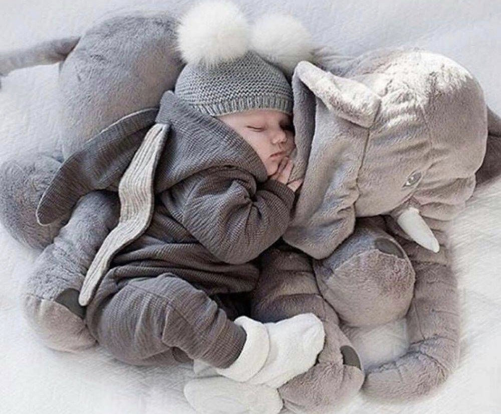 Cozy baby elephant pillow, an ultra-soft plush toy for comforting kids and charming nursery decor.