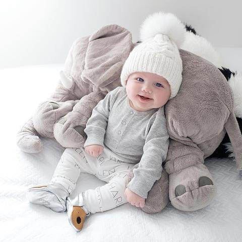 Grey baby elephant cuddle pillow, an ultra-soft and comfortable plush toy designed for infants.