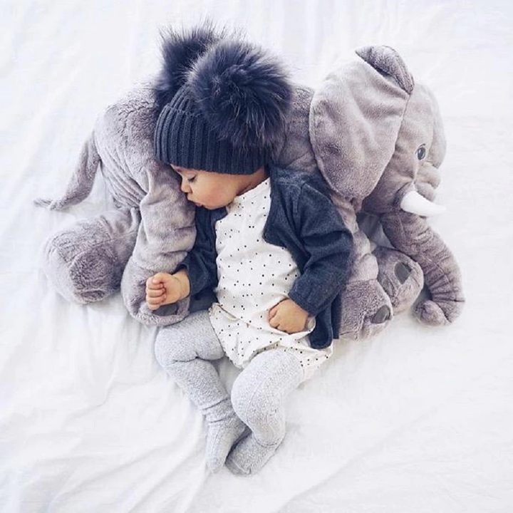Cute baby elephant cuddle pillow, a soft and huggable plush toy for adorable nursery decor.