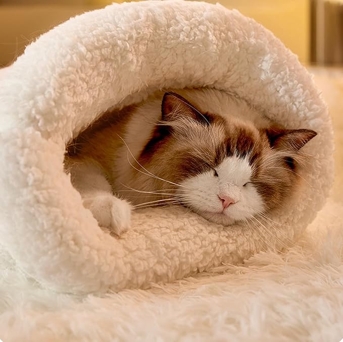 Plush cat bed and sleeping bag, designed as a cozy cave for ultimate feline comfort. Machine washable.