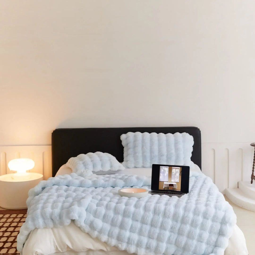 Premium ultra-soft plush throw blanket. Enjoy unparalleled warmth and comfort in your bedroom.