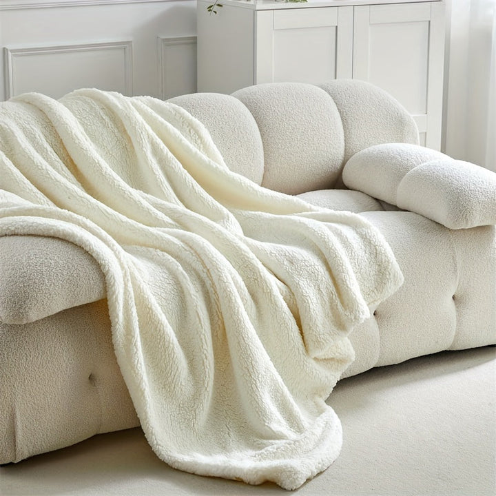 Cozy sherpa fleece throw blanket, perfect for warmth & comfort in any home living space.