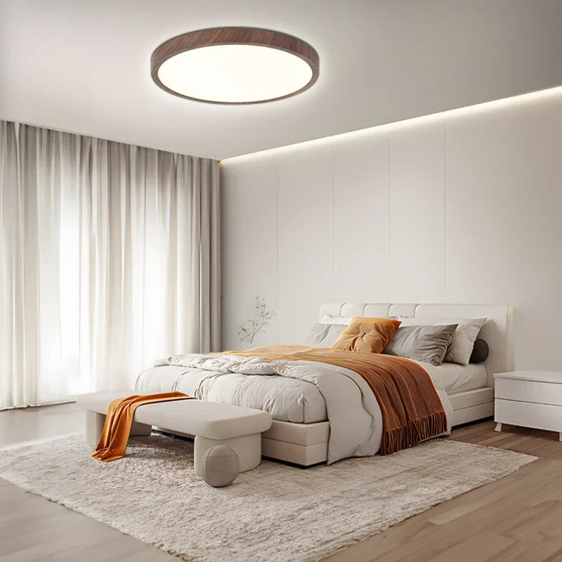 Modern adjustable LED ceiling light with warm walnut finish. Ideal circular fixture for dining rooms & living rooms.