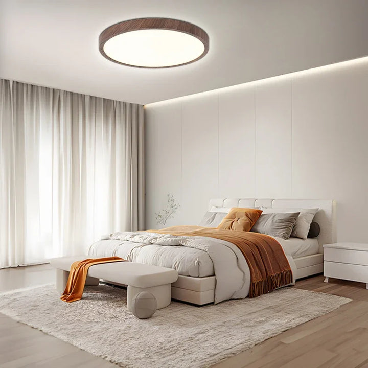 Modern adjustable LED ceiling light with warm walnut finish. Ideal circular fixture for dining rooms & living rooms.