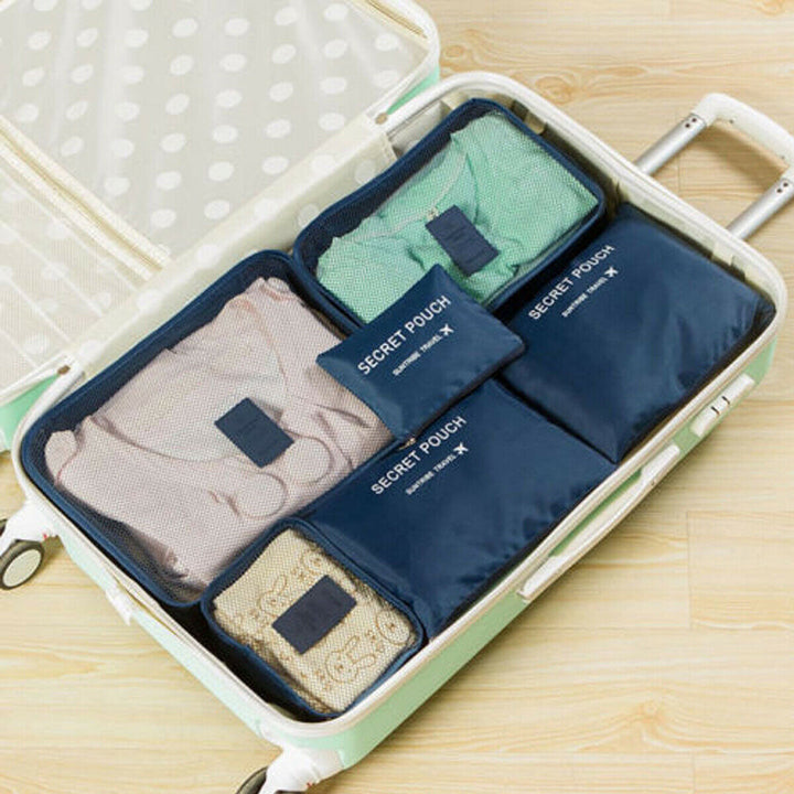 Efficient travel packing organizer set, 12 pieces for men & women, maximizing suitcase space.
