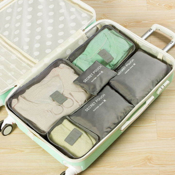 Space-saving travel storage bags, a 12-piece unisex packing set for organized luggage.