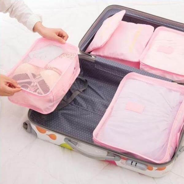 Durable 12-piece travel packing cube set, perfect for men and women seeking neat suitcase organization.