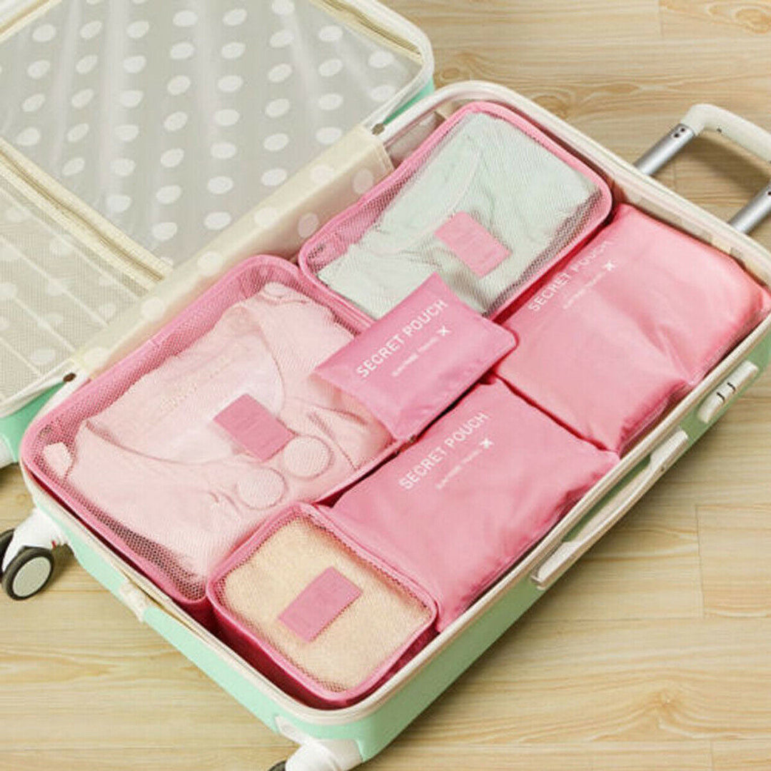 Essential 12-piece unisex travel accessory set for optimized luggage space and organization.