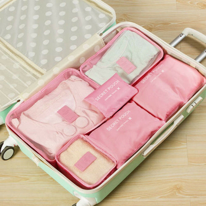 Essential 12-piece unisex travel accessory set for optimized luggage space and organization.