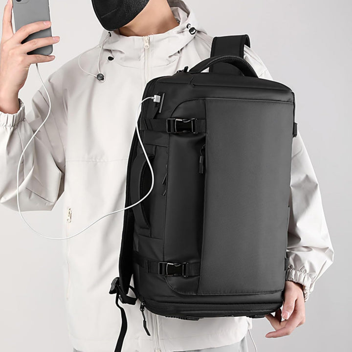 Padded 15" laptop compartment in a waterproof backpack, ensuring secure and protected tech transport.