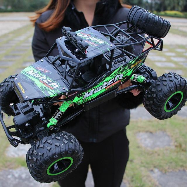 RC 4x4 monster truck speeding off-road on dirt, kicking up dust. Durable remote control toy for outdoor fun.