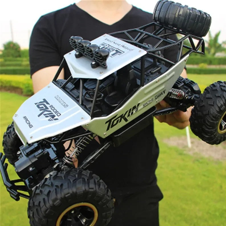 Kids & adults enjoying a high-speed remote control 4x4 RC monster truck. Perfect durable off-road gift toy.
