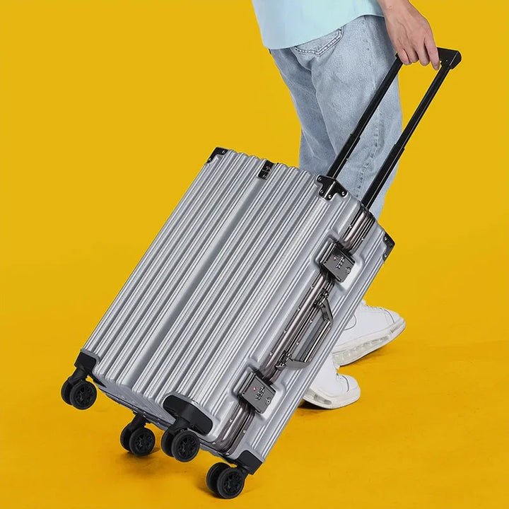 Ergonomic handle & smooth spinner wheels on a unisex aluminum frame hard-shell travel bag. Secure luggage.