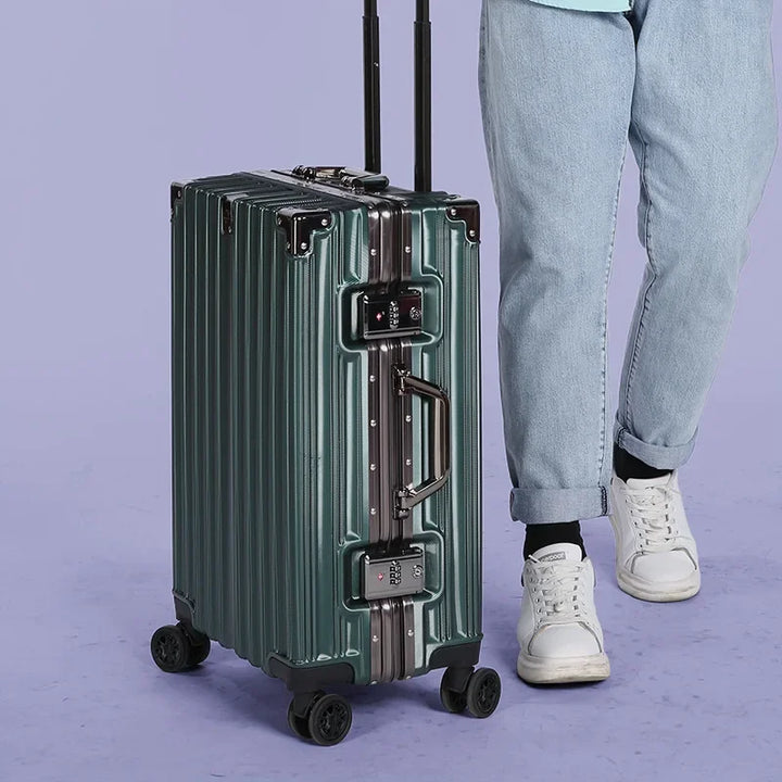 Unpacked unisex aluminum frame hard-shell suitcase. Secure, durable luggage, ready for your next adventure.