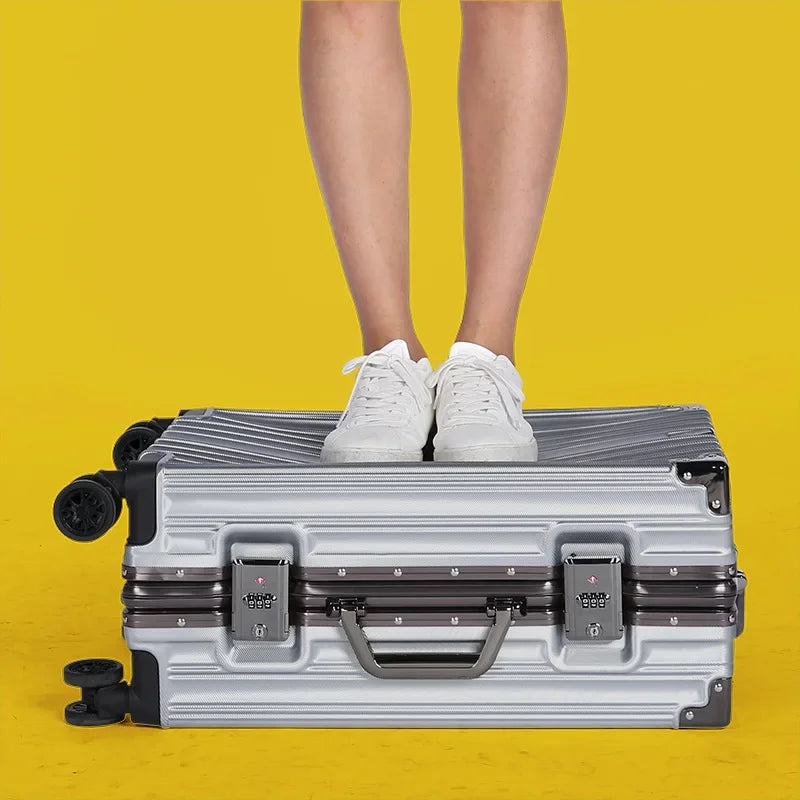 Open unisex aluminum frame hard-shell suitcase, showing spacious interior for organized packing.