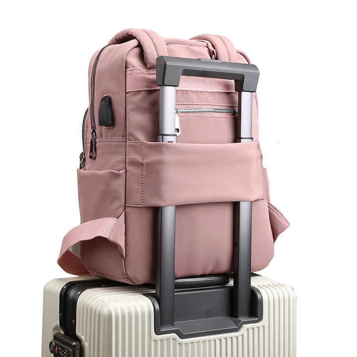 Unisex anti-theft backpack with USB charging. Water-resistant, multi-compartment for secure travel & commute.