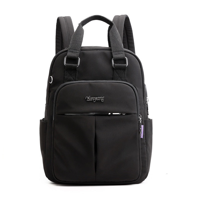 Stylish anti-theft backpack worn by traveler. USB charging, water-resistant. Perfect for adventures & daily life.