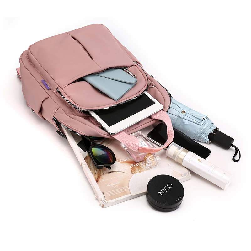 Multi-compartment unisex anti-theft travel bag. USB charging & water-resistant for organized, safe journeys.
