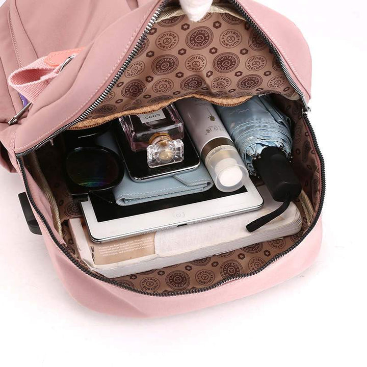 Sleek anti-theft commute backpack. USB charging, water-resistant material. Perfect for daily essentials & tech.