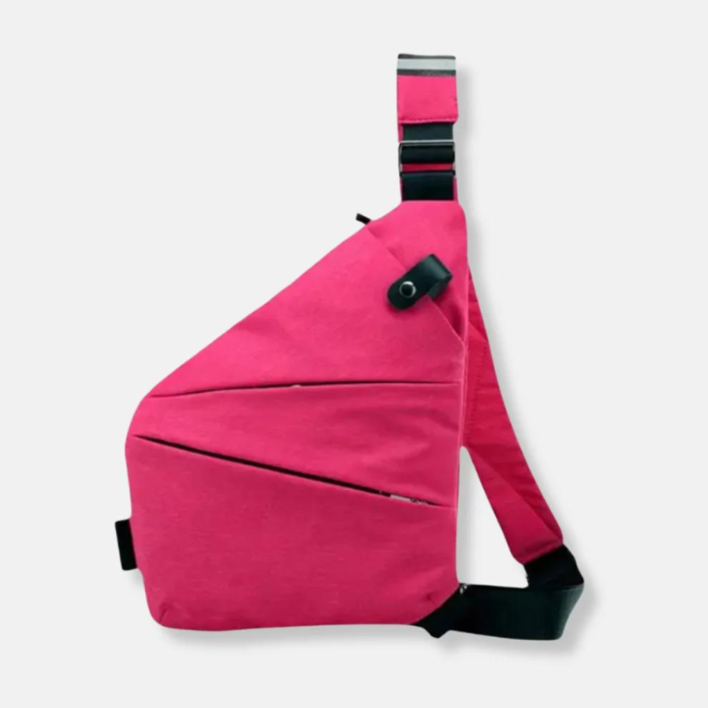 Unisex Anti-Theft Urban Crossbody Bag on a table with other travel essentials
