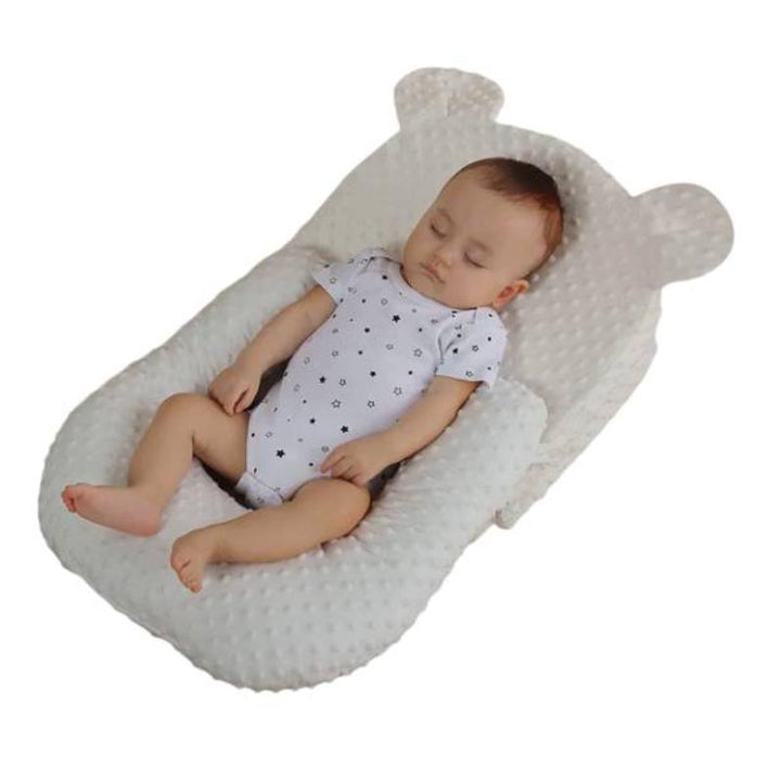 Portable & easy-clean baby feeding pillow, offering essential anti-spit up and comfort for infants on the go.