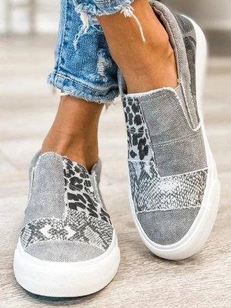 White unisex slip-on casual shoes with enhanced arch support and easy-wear design