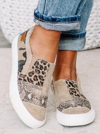 Comfortable grey slip-on shoes for men and women, featuring arch support and stretch fit