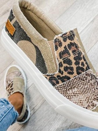 Close-up of a unisex slip-on sneaker showcasing its arch support and flexible material