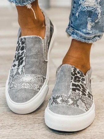 Unisex grey slip-on sneakers, designed for all-day comfort with arch support features