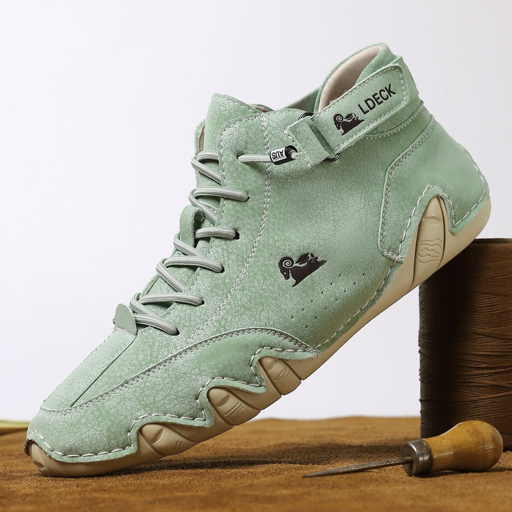 Close-up of flexible sole on new unisex leather barefoot shoes for outdoor traction.