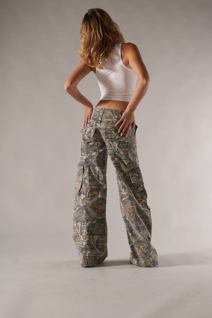 Fashionable women's camo cargo pants with spacious pockets, great for trendy outfits.