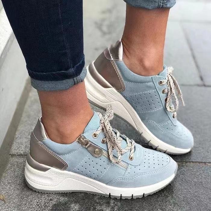 Stylish unisex walking sneakers, white with blue accents, offering arch support