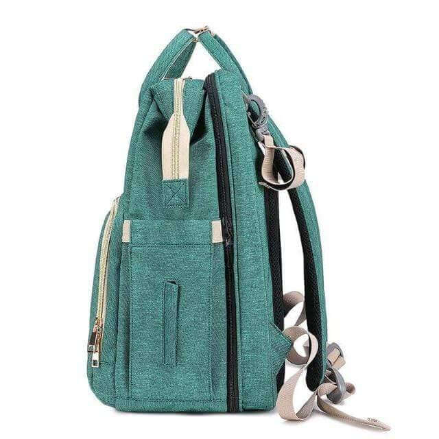 Spacious multi-pocket baby nappy bag with an easy-to-deploy foldable bassinet. Ideal for baby essentials.