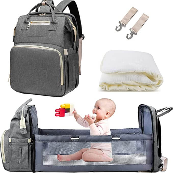 Essential parenting travel bag: a waterproof multi-pocket diaper backpack & foldable baby bassinet.