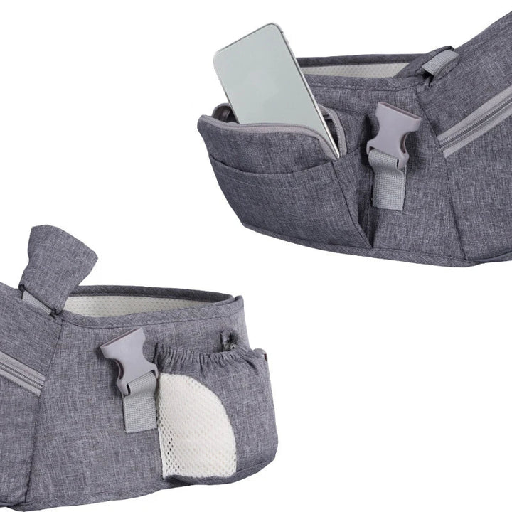 Parent comfortably wearing an ergonomic hip seat baby carrier with an infant, offering hands-free support.