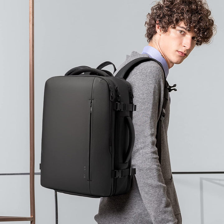Unisex travel backpack with duffle bag carry option, 26-45L, for versatile travel.